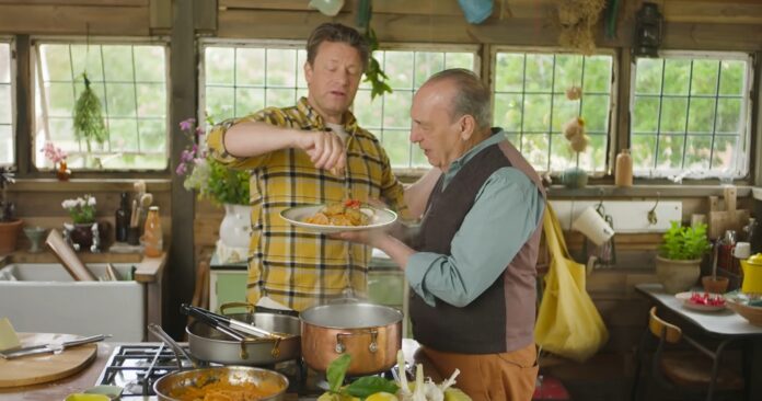 Jamie Oliver and Gennaro Contaldo cooking together in a rustic kitchen