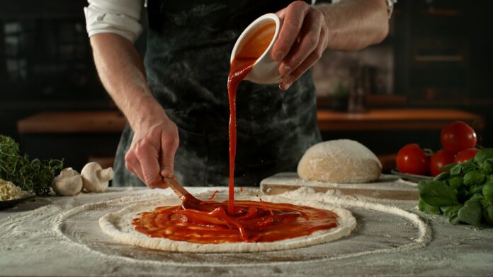 Closeup,Of,Chef,Making,Pizza,In,Restaurant,.,Closeup,Of Pizza Sauce vs Marinara